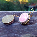 photo of pink circular ceramic tile earrings with back side