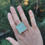 Photo of aqua glass tile silver-plated adjustable ring on hand