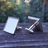 Photo of off-white silver-plated faux-leather upholstery cuff links from the side