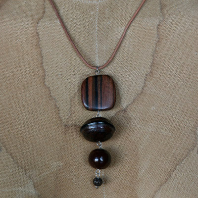 Wood and seed pendant on leather cord