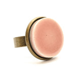 Pink ceramic tile dark brass ring
