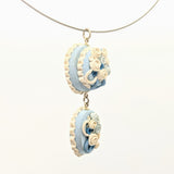 Blue and white double dollhouse cake pendant necklace on steel cable