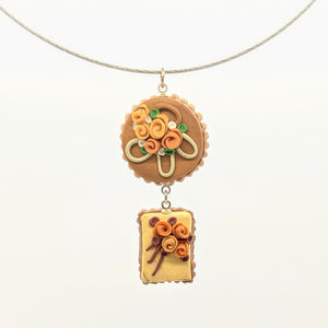 Brown and yellow double dollhouse cake pendant necklace on steel cable