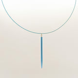 Pointed knitting needle pendant on cable