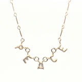 Silver alphabet soup "peace" necklace