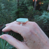 Photo of aqua glass tile silver-plated adjustable ring on hand from side