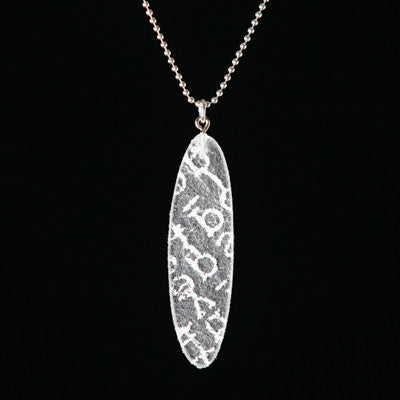 Small recycled plastic pendant with white type - Amy Jewelry
