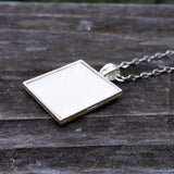 Photo of silver-plated upholstery pendant, 3/4 view
