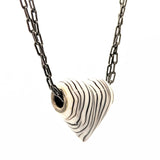 Zebra-striped heart necklace